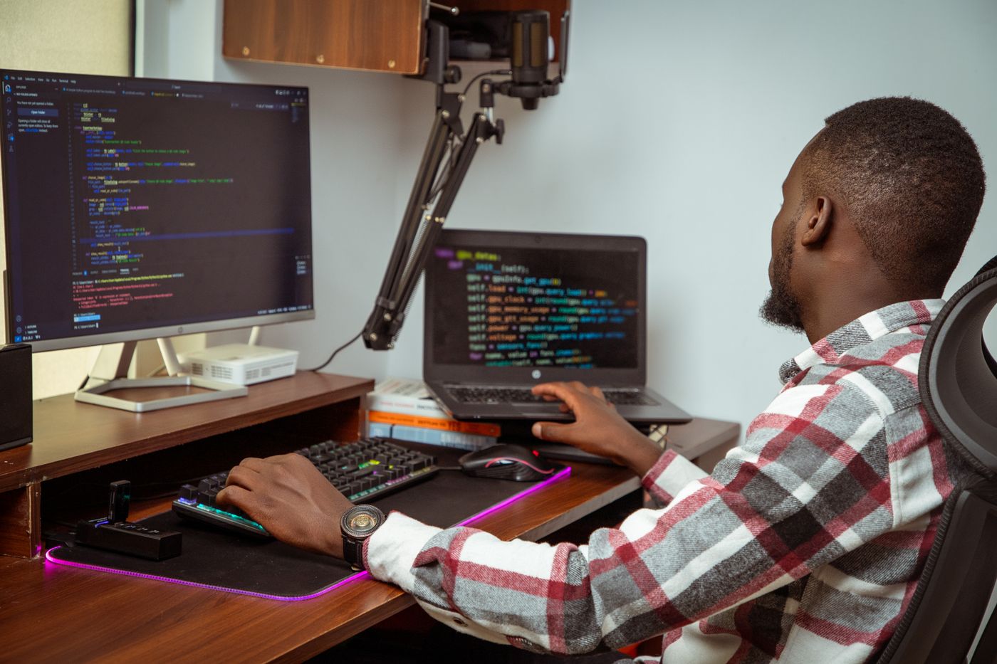 A software developer working at computers in a Nairobi office