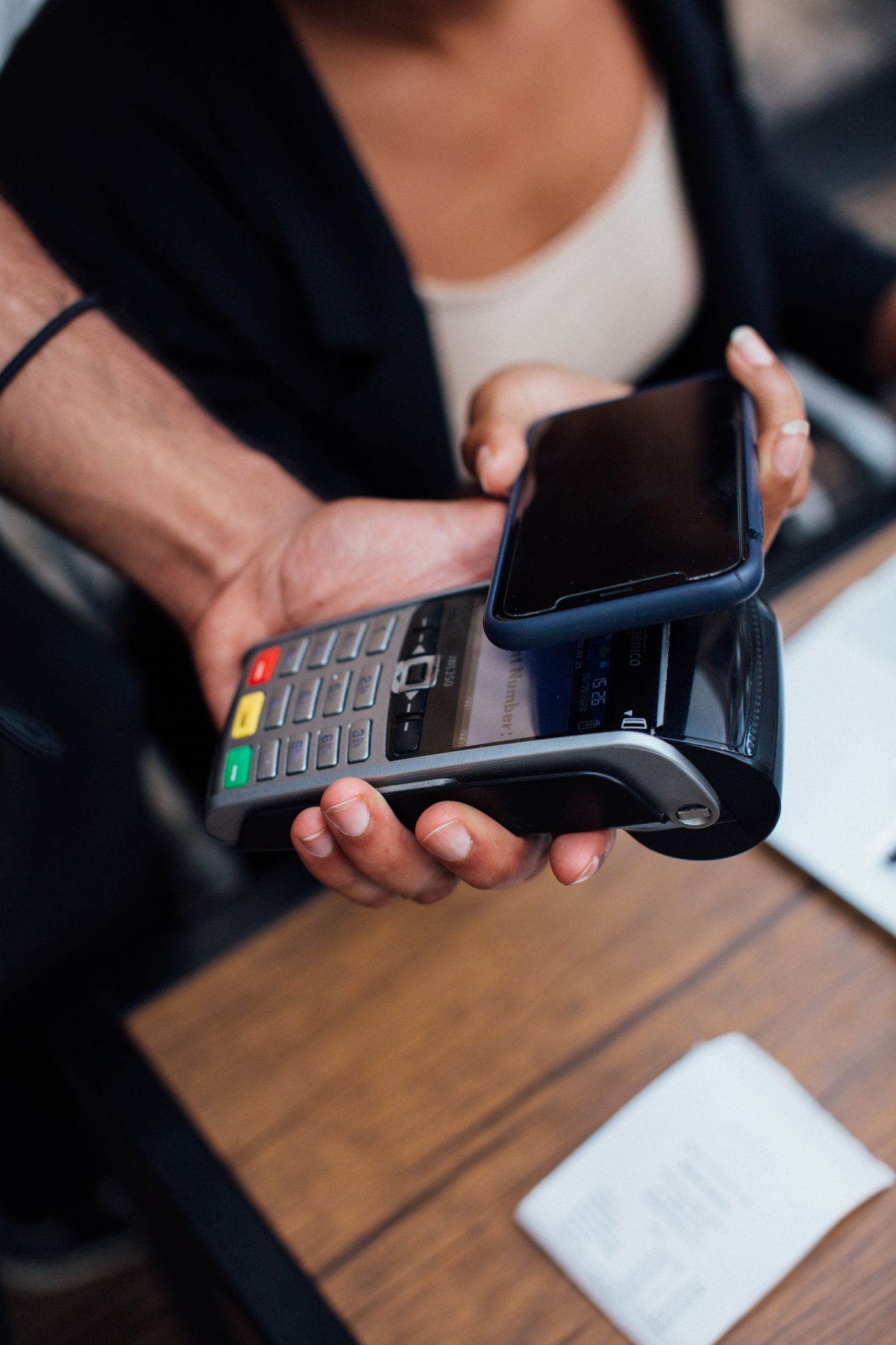 A customer making a contactless payment with a smartphone